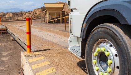 Truck entering a weighing scale in a quarry.