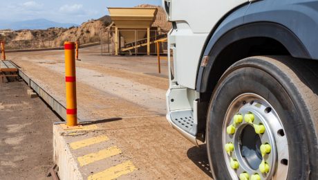 Truck entering a weighing scale in a quarry.